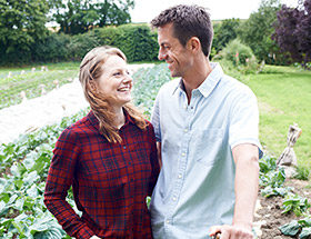 happy couple outside in field